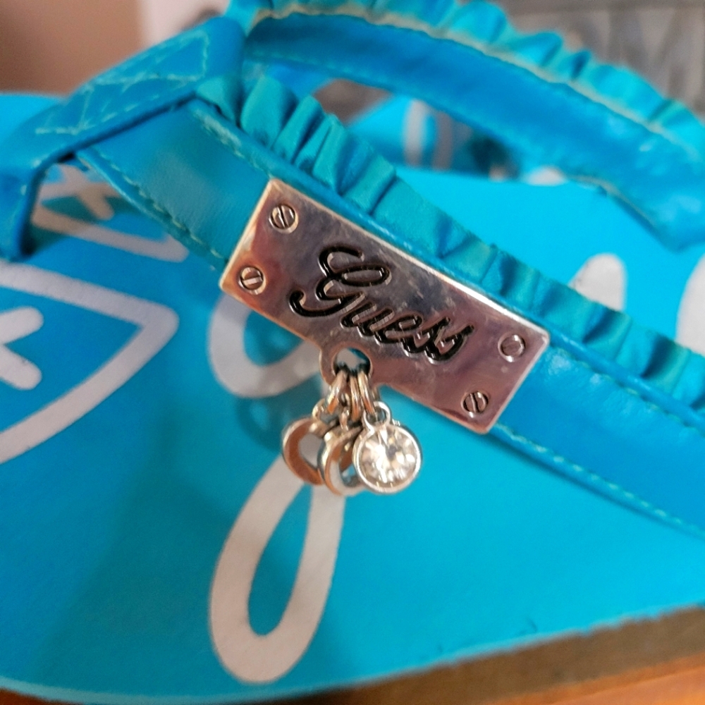 Guess Turquoise Flip Flops with Silver Charm